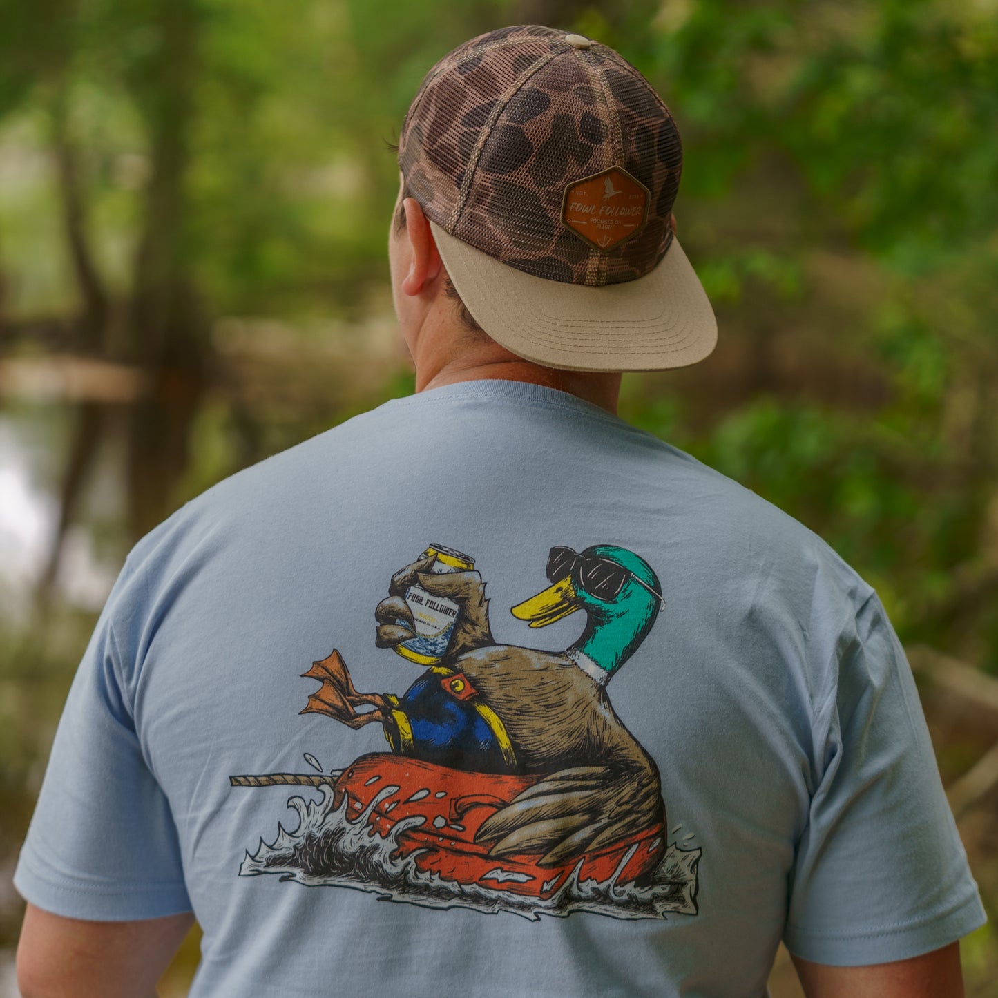 A man with a Fowl Follower Mobbin' Mallard Tee on his back.