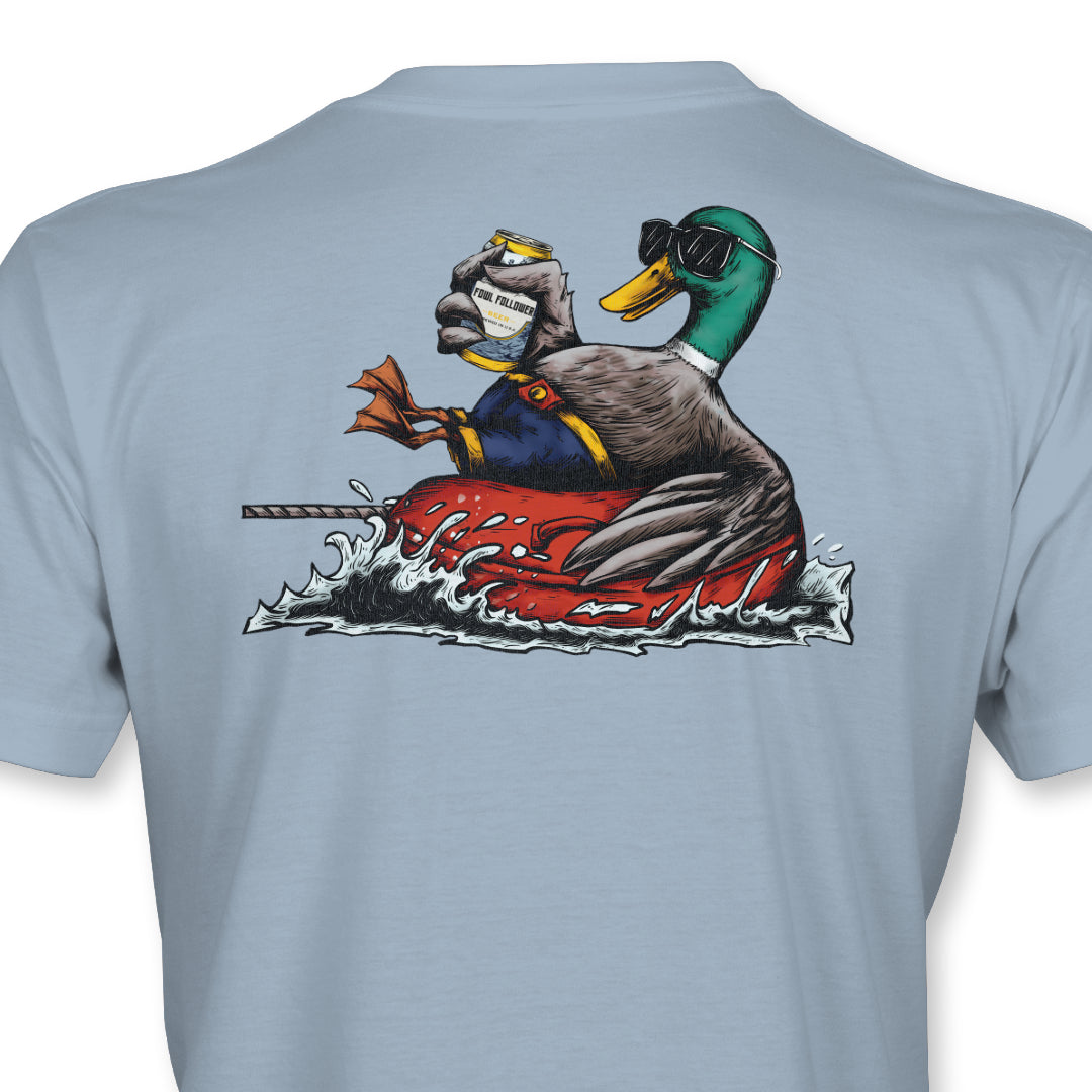 A Mobbin’ Mallard Tee from Fowl Follower with a duck on a red boat.